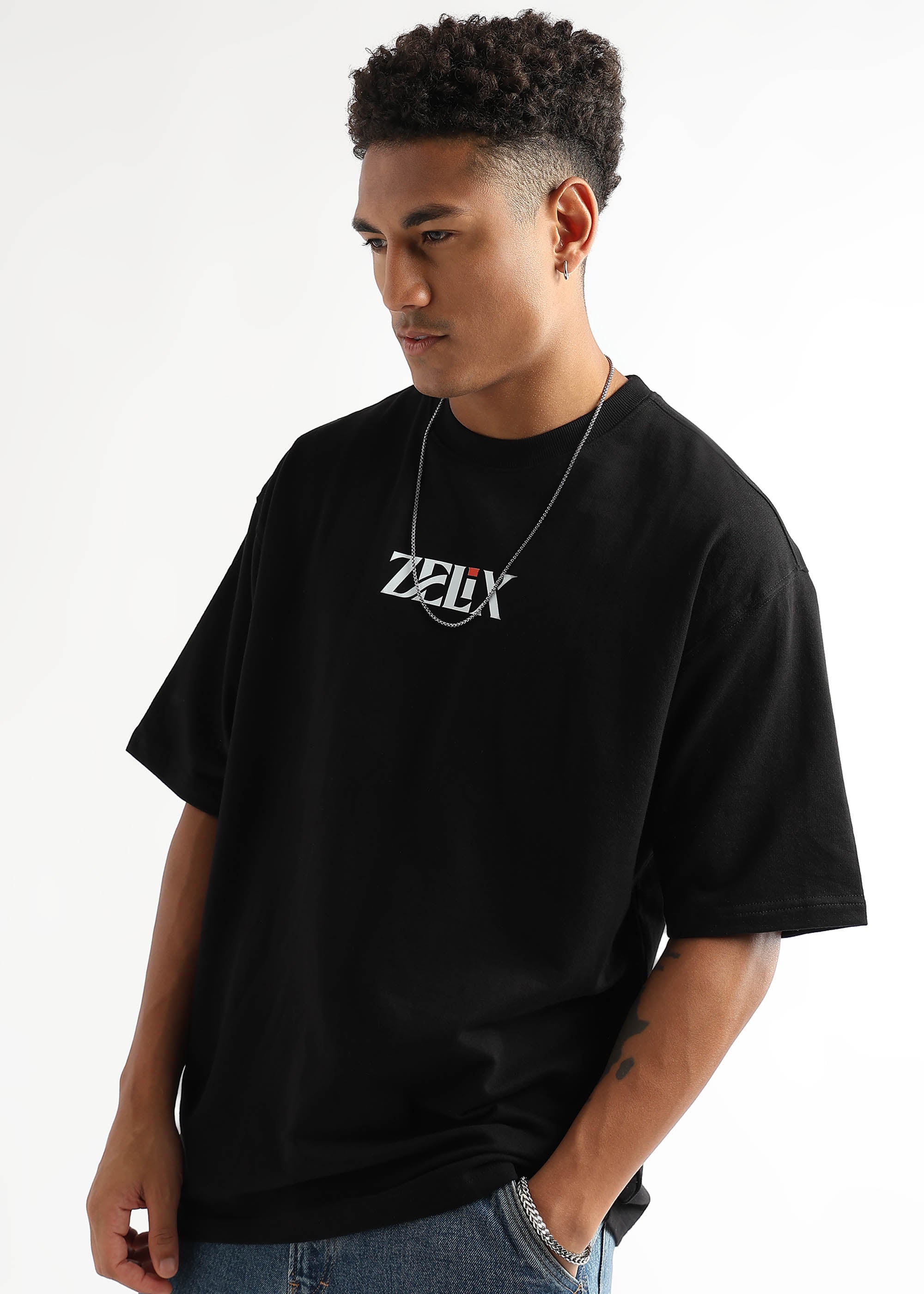 Bold white print on black oversized t-shirt