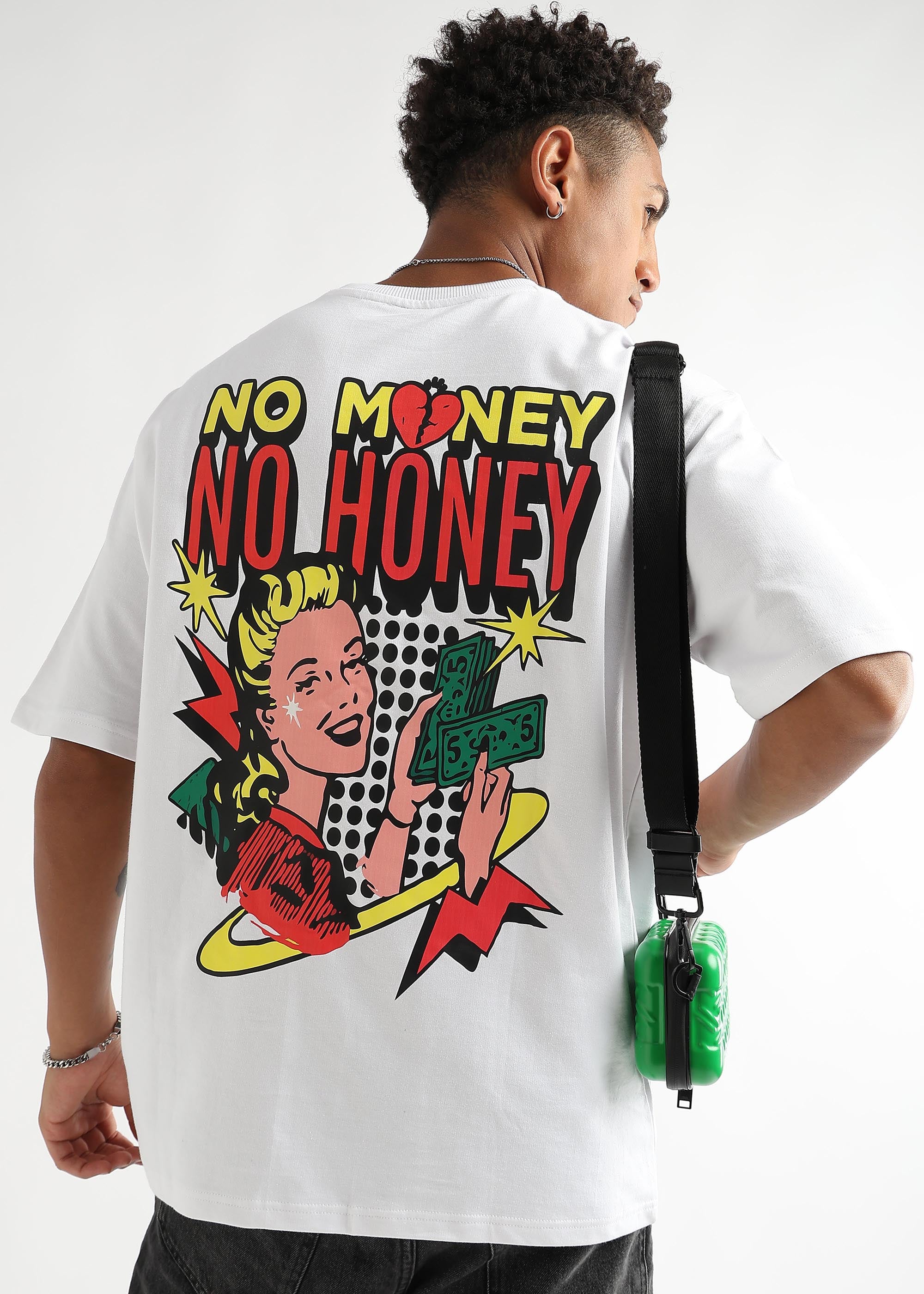 A person wearing an oversized white t-shirt with a text graphic on the back.