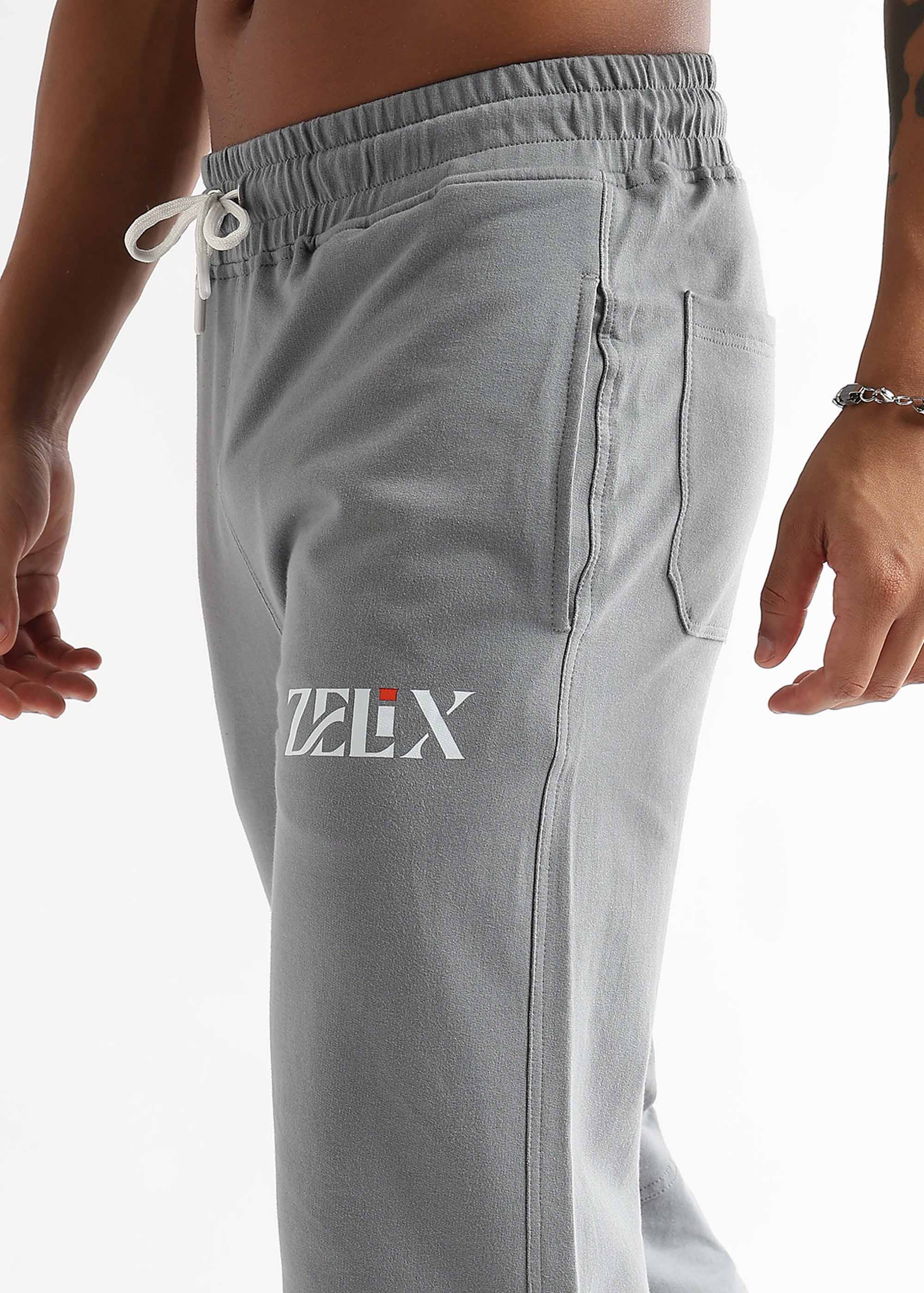 Grey jogger trousers with urban flow graffiti design