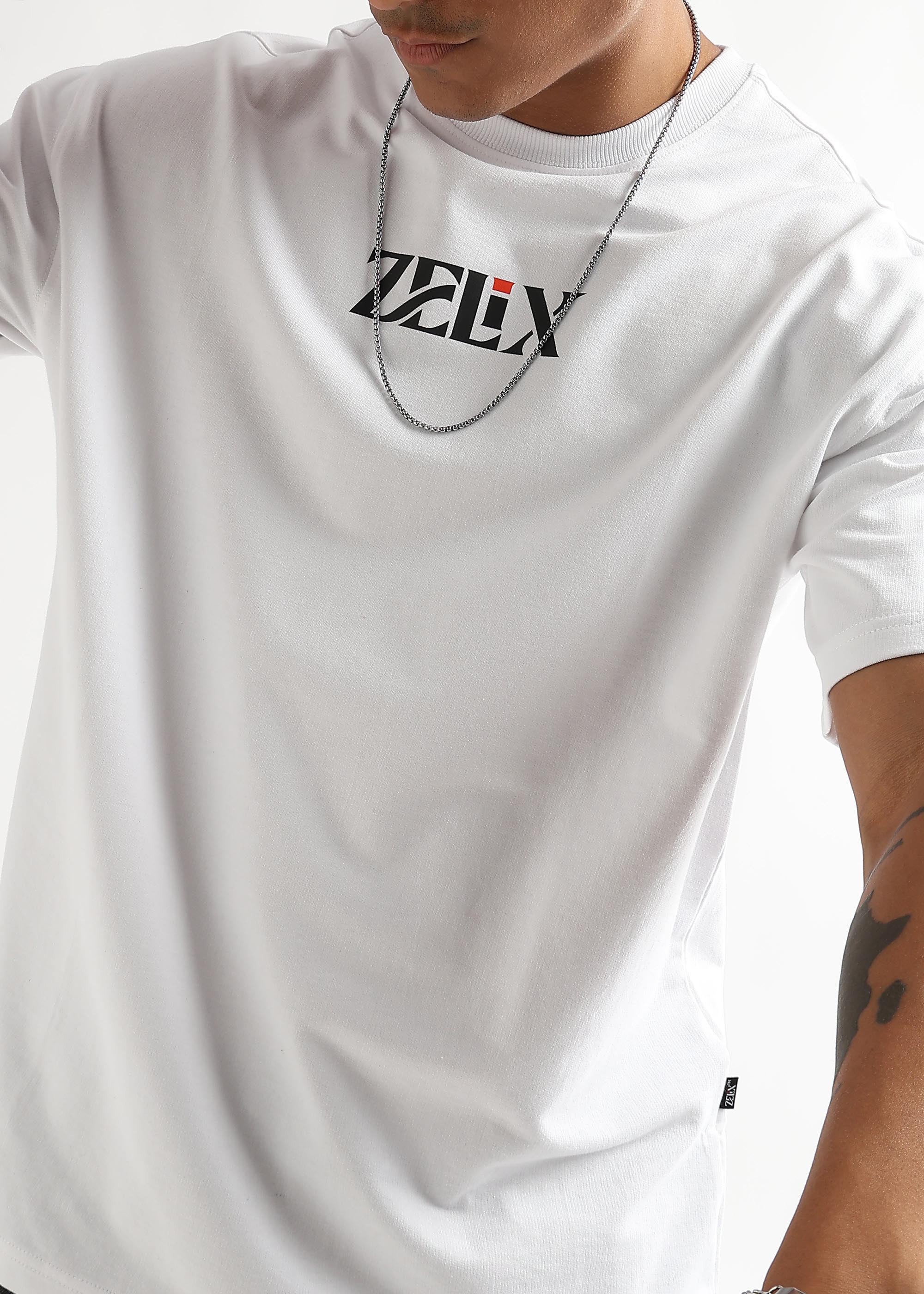 White oversized Wings of Belief fashion graphic shirt