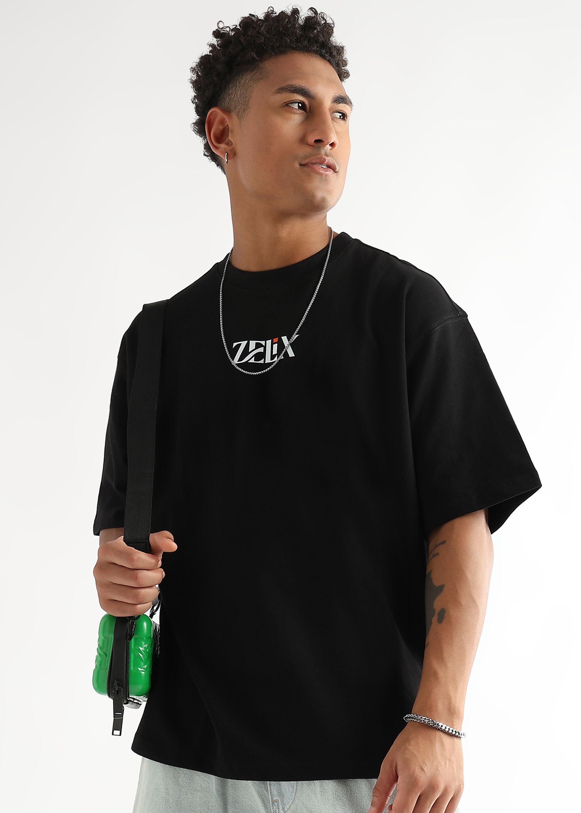 Unisex oversized “Chase and Conquer” graphic shirt