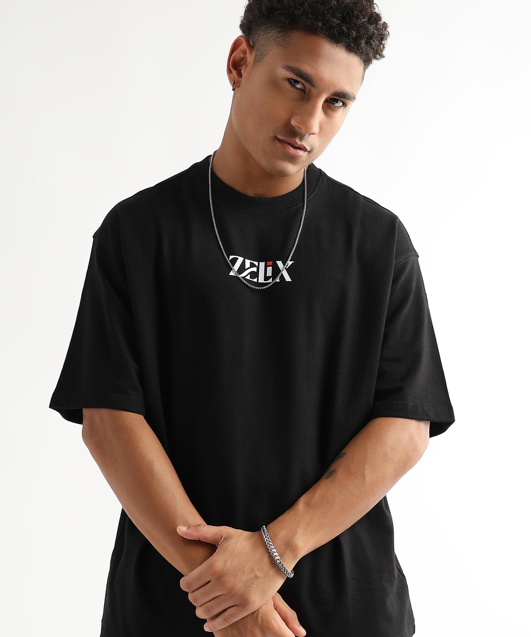 Black oversized “Chase and Conquer” streetwear t-shirt