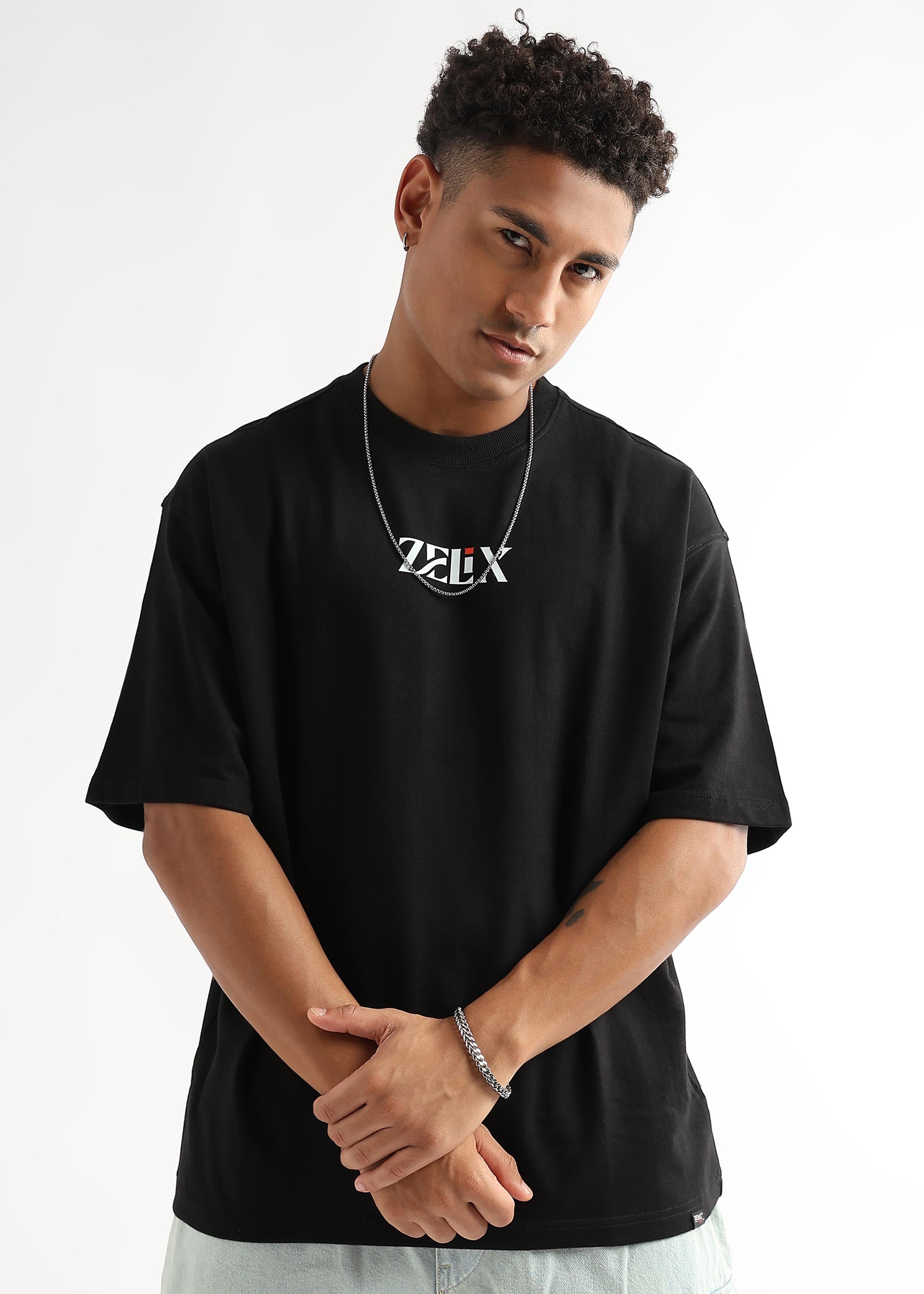 Black oversized “Chase and Conquer” streetwear t-shirt