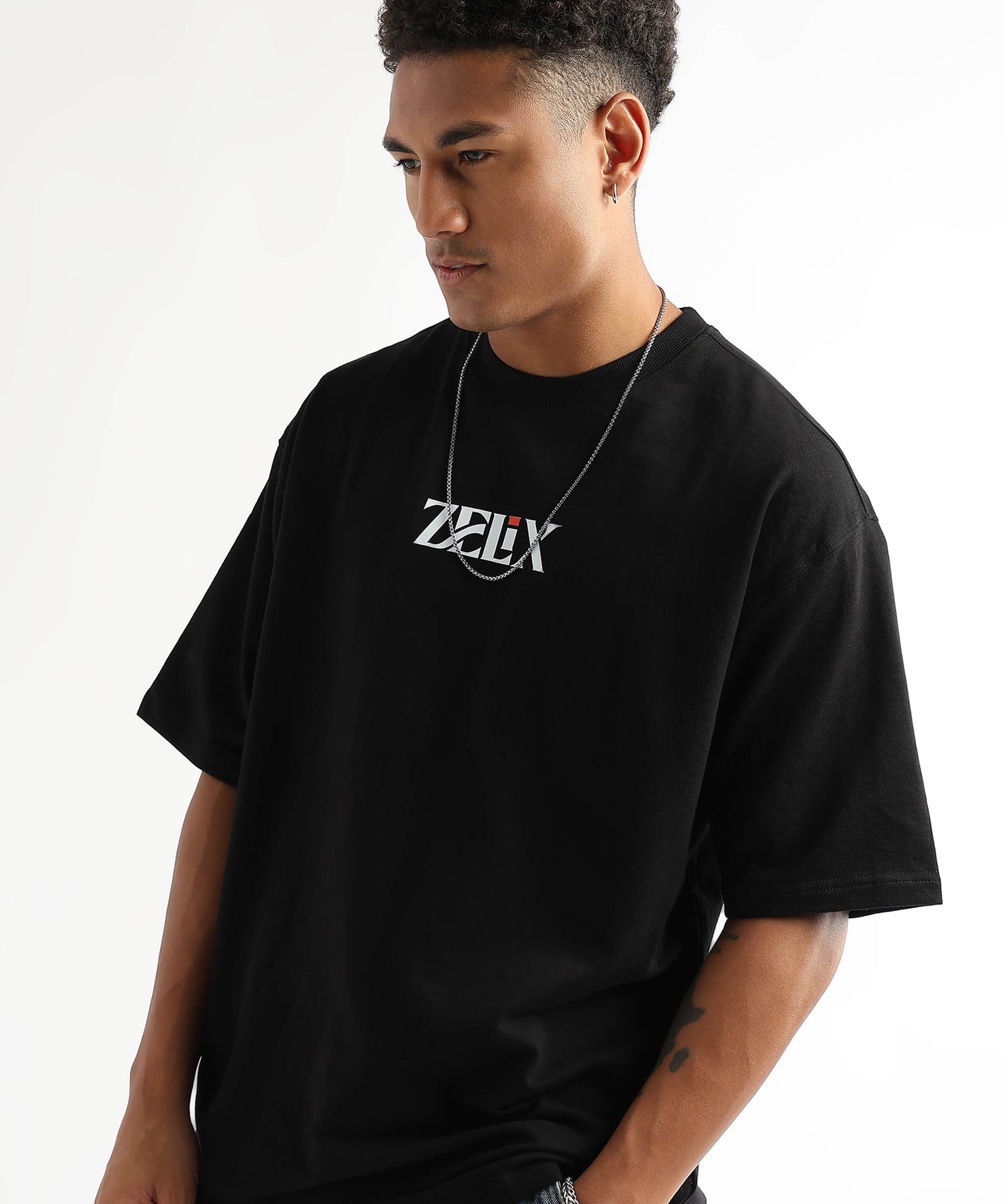 Bold white print on black oversized t-shirt