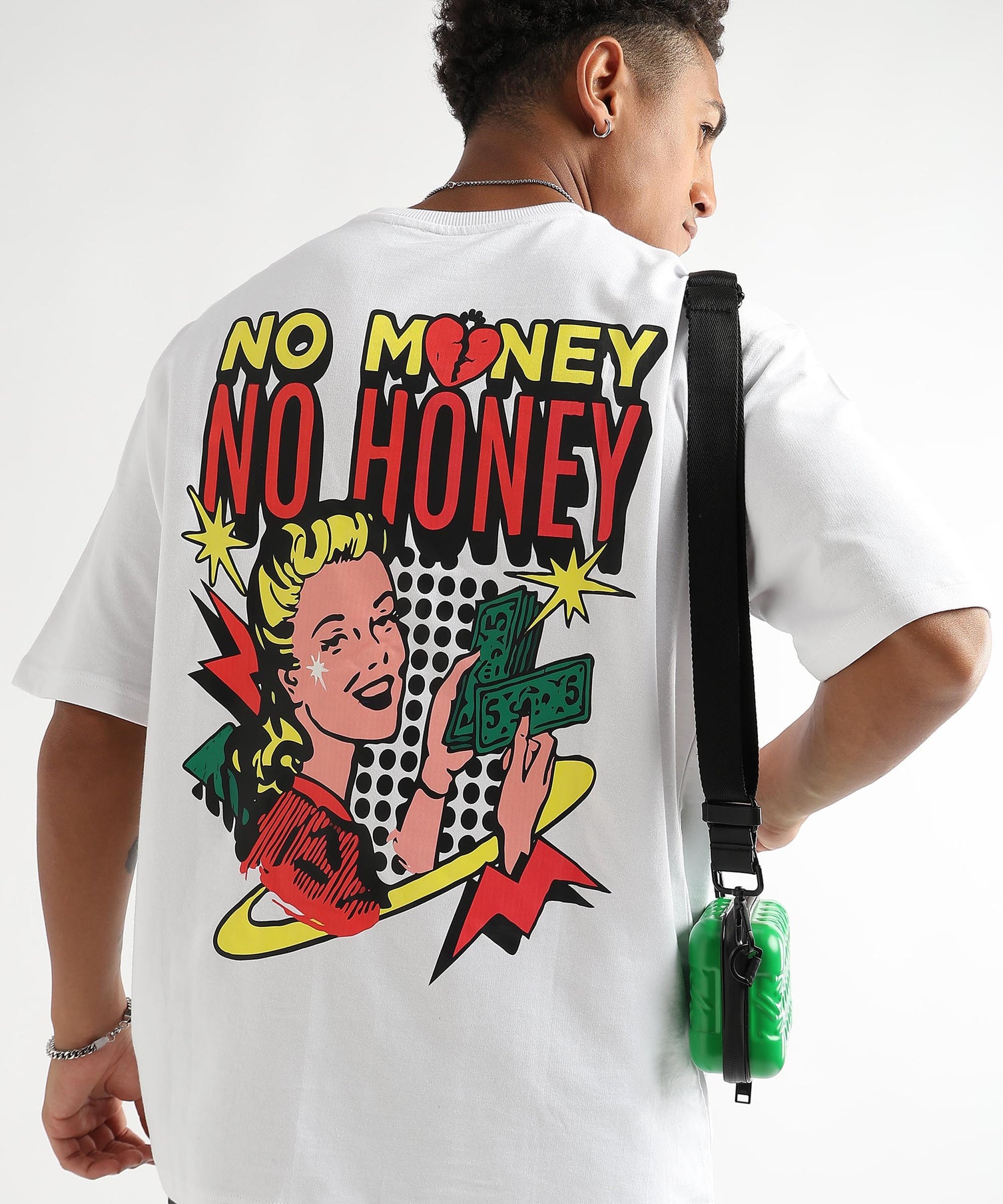 A person wearing an oversized white t-shirt with a text graphic on the back.