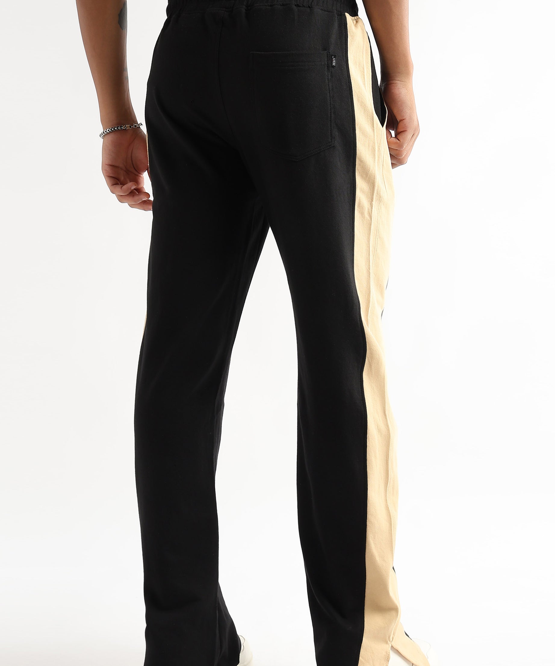 Tapered black jogger pants with beige side slit