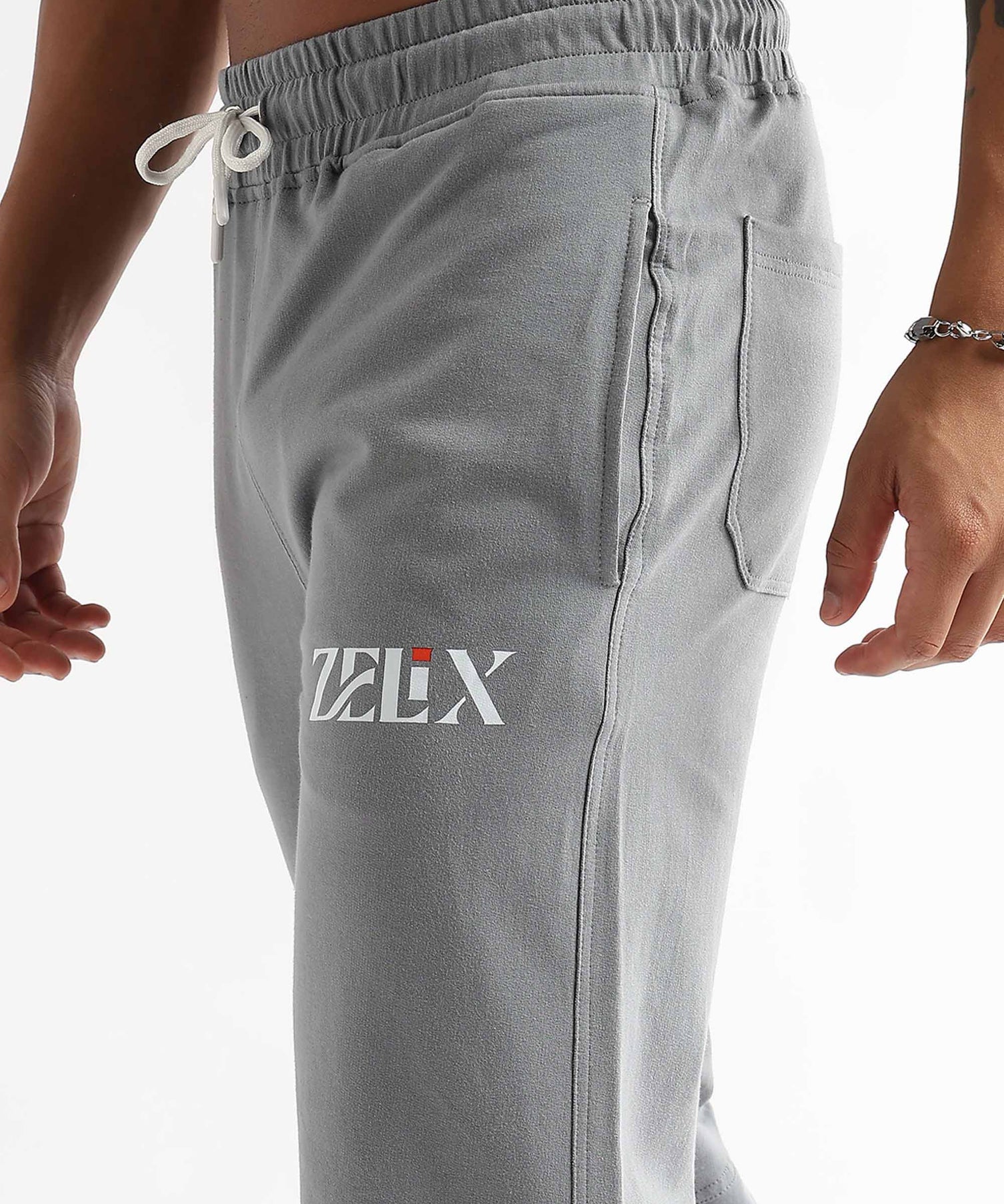 Grey jogger trousers with urban flow graffiti design