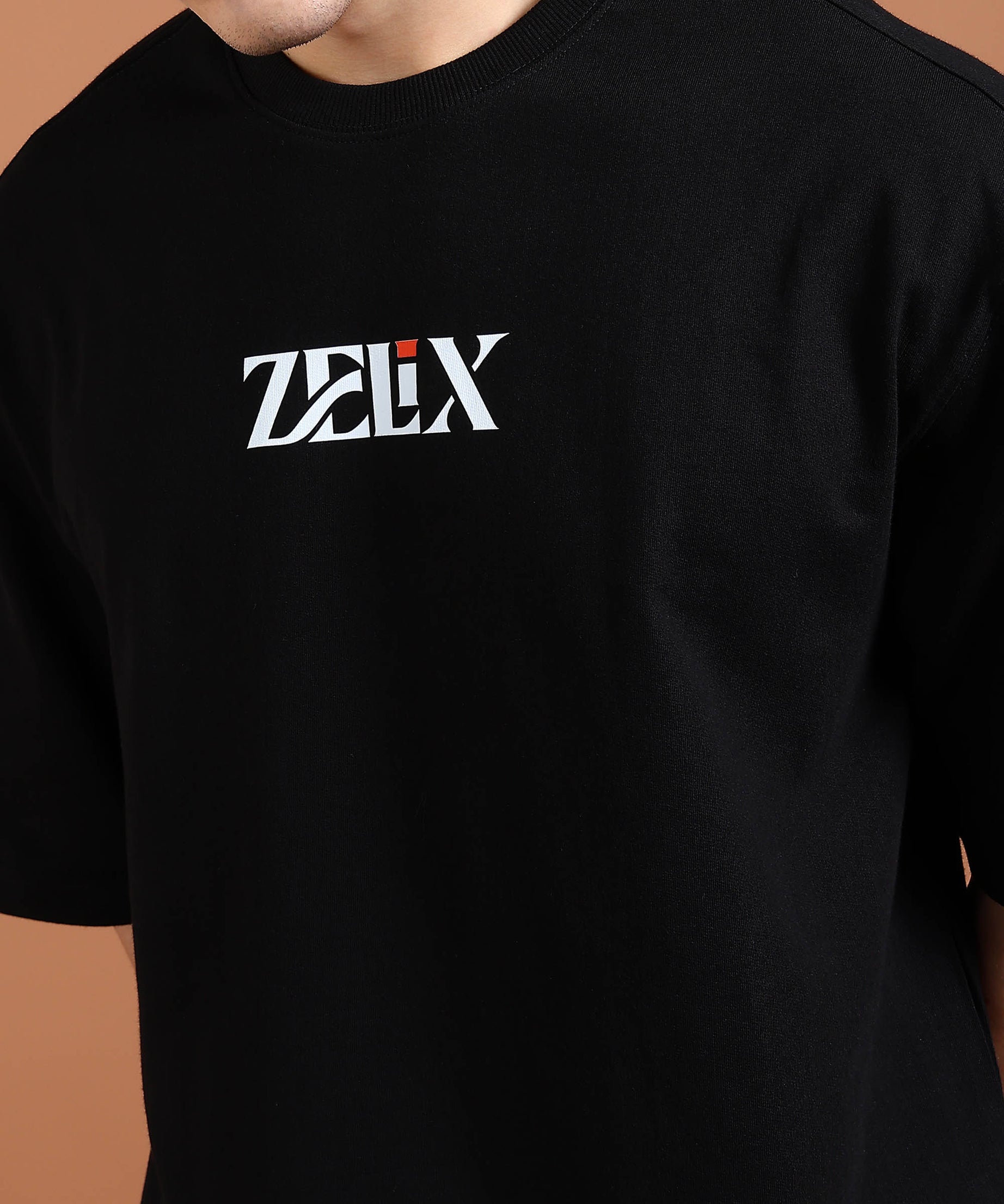 Men’s and women’s bold print black oversized tee