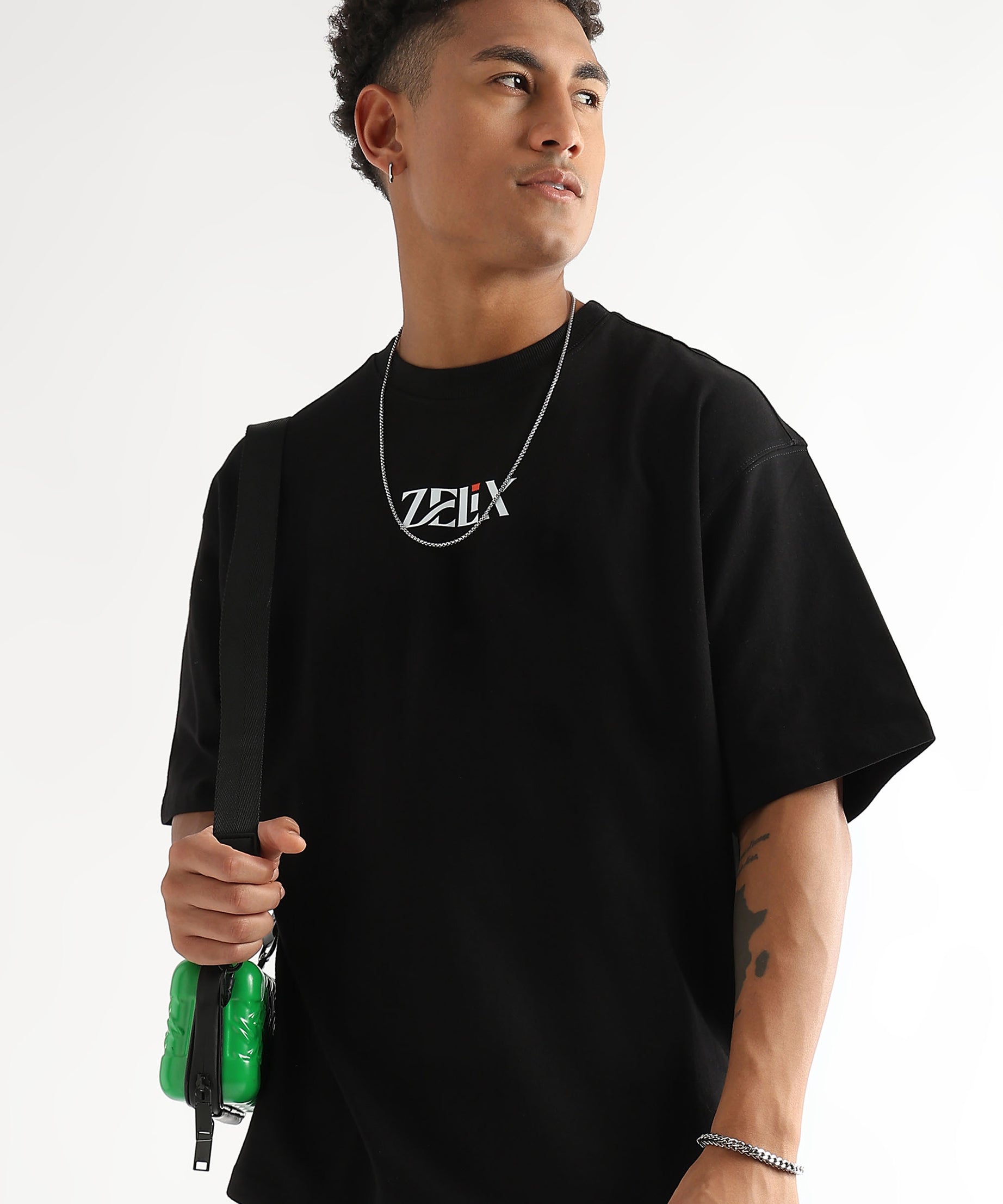 Unisex oversized “Chase and Conquer” graphic shirt