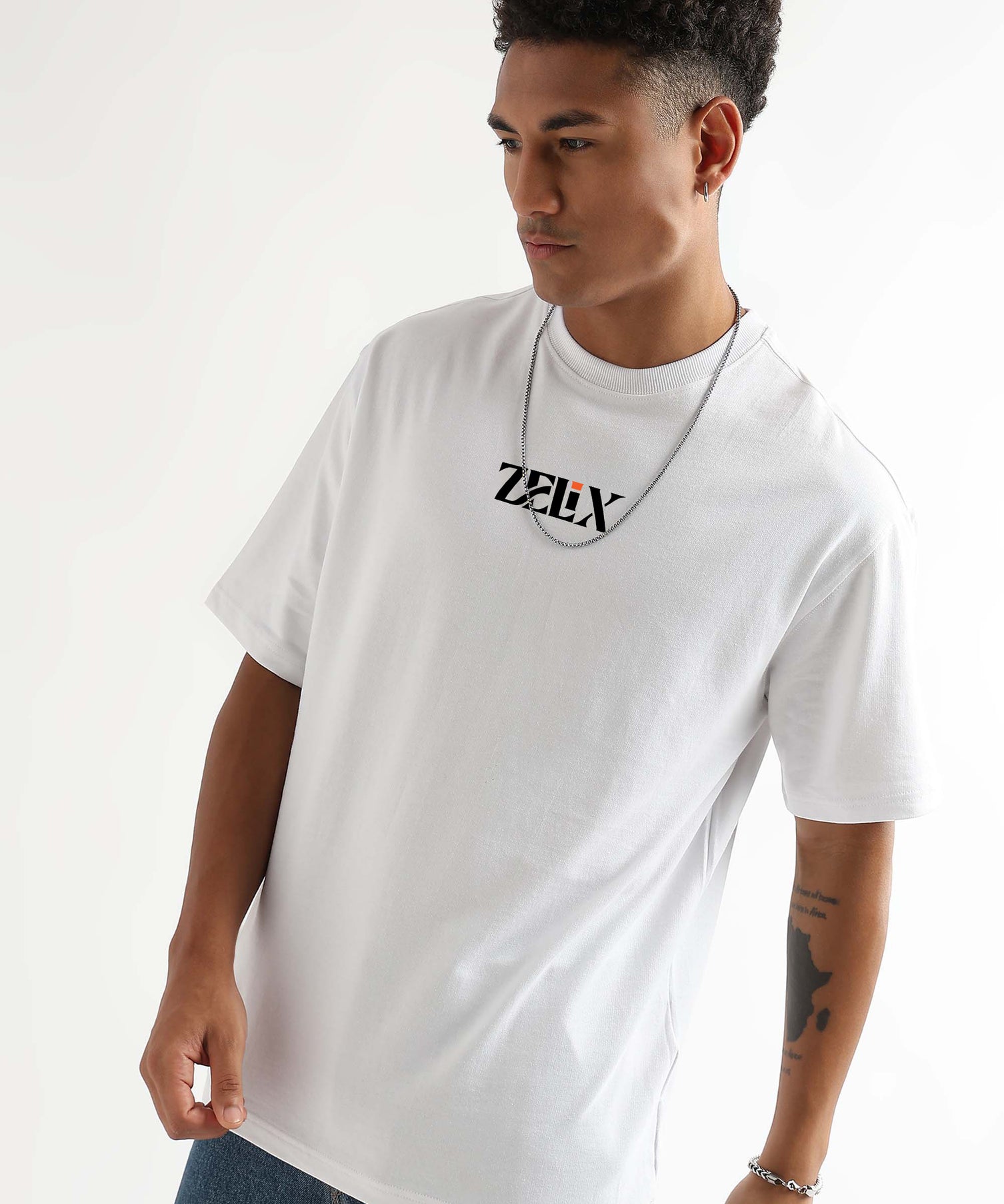 Man wearing a white t-shirt with a logo on a plain background